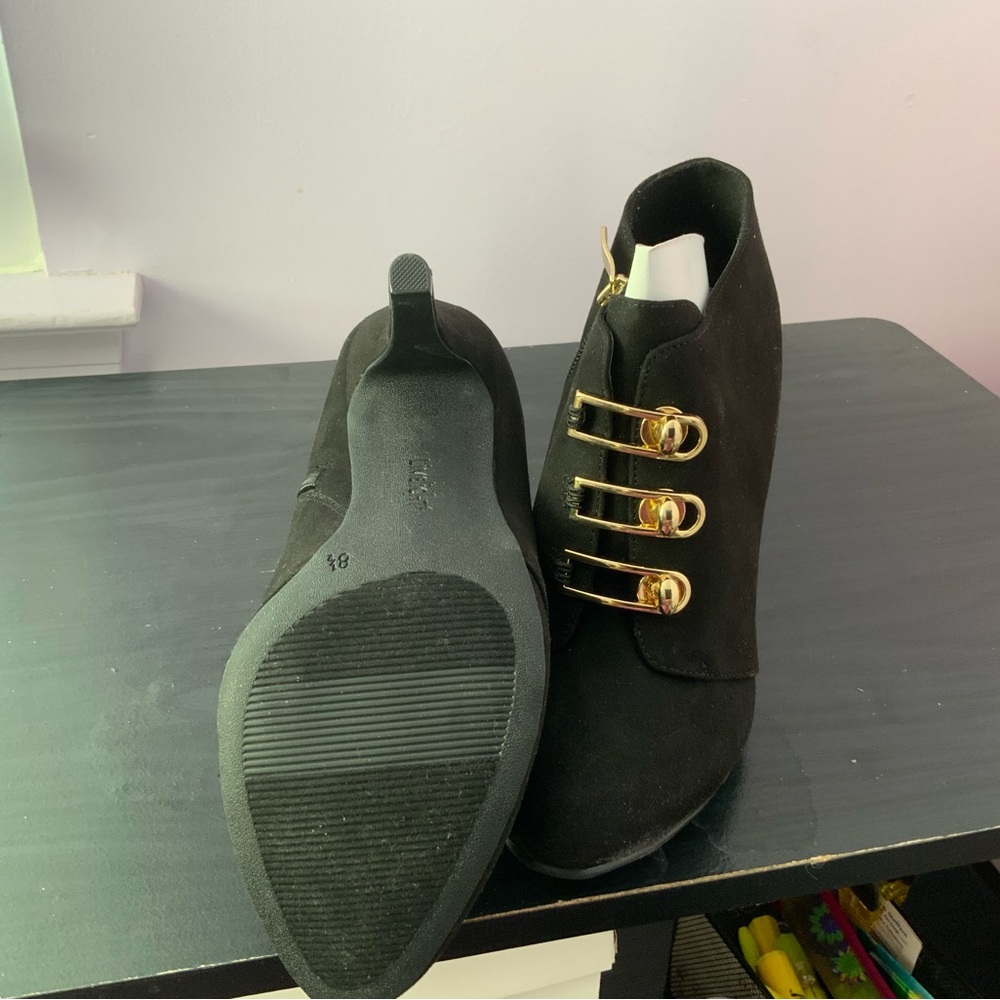 Elegant Black Ankle Boots with Gold Accents